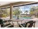 Relax by the pool with lake views on the screened lanai with outdoor seating at 430 Bywater Dr, Orlando, FL 32839