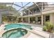 A screened pool and patio area with outdoor seating are perfect for relaxing and entertaining at 430 Bywater Dr, Orlando, FL 32839