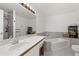 Bright bathroom features a large mirror, double sinks, and soaking tub at 4700 Buggywhip Ln # 102, Orlando, FL 32812