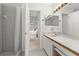 Bright bathroom features a large vanity, a shower, and easy access to the bedroom at 4700 Buggywhip Ln # 102, Orlando, FL 32812