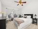 Bright bedroom with vaulted ceiling, ceiling fan, and large window at 4700 Buggywhip Ln # 102, Orlando, FL 32812