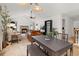 Bright open-plan dining space featuring a vaulted ceiling and seamless flow into the living room at 4700 Buggywhip Ln # 102, Orlando, FL 32812