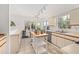 Bright kitchen features white cabinetry and stainless-steel appliances, offering a clean and functional cooking space at 4700 Buggywhip Ln # 102, Orlando, FL 32812