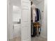 Walk-in closet providing ample storage space with easy access to the bath at 4700 Buggywhip Ln # 102, Orlando, FL 32812