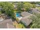 Aerial view showing home featuring a private pool and fenced backyard, surrounded by mature trees at 503 Gumwood Ct, Altamonte Springs, FL 32714