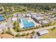 Community center featuring a large pool, shaded seating areas, and ample parking at 503 Gumwood Ct, Altamonte Springs, FL 32714