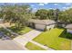Aerial view of a single-Gathering home highlighting the well-maintained lawn, driveway, and neighborhood setting at 503 Gumwood Ct, Altamonte Springs, FL 32714