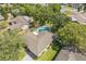 Aerial view of a home with a private, fenced pool and a lush, green yard at 503 Gumwood Ct, Altamonte Springs, FL 32714
