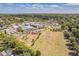 Aerial view of community amenities including a pool, tennis courts, and a playground at 503 Gumwood Ct, Altamonte Springs, FL 32714