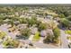 Aerial view showcases a community with tree-lined streets and well-maintained homes at 503 Gumwood Ct, Altamonte Springs, FL 32714