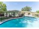 Backyard view showcasing the pool, landscaping, and exterior of the home at 503 Gumwood Ct, Altamonte Springs, FL 32714