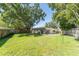 Expansive backyard with a fenced pool, mature trees, and a well-maintained lawn at 503 Gumwood Ct, Altamonte Springs, FL 32714