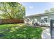 Well-kept backyard with a privacy fence, a small patio, and some mature trees at 503 Gumwood Ct, Altamonte Springs, FL 32714