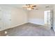 Bright bedroom with neutral walls, carpeting, ceiling fan, and ensuite bathroom at 503 Gumwood Ct, Altamonte Springs, FL 32714