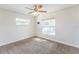 Sunlit bedroom with backyard pool view, neutral palette, carpet, and ceiling fan at 503 Gumwood Ct, Altamonte Springs, FL 32714