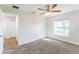 This well-lit bedroom features a double closet, large window, neutral color palette, and plush carpet at 503 Gumwood Ct, Altamonte Springs, FL 32714