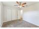 Bedroom featuring a double closet, neutral palette, ceiling fan, and plush carpet at 503 Gumwood Ct, Altamonte Springs, FL 32714