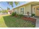 Close-up of a home's exterior, showcasing the landscaped garden and inviting entrance at 503 Gumwood Ct, Altamonte Springs, FL 32714