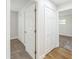 Hallway featuring a combination of carpet and wood flooring, and built-in closets at 503 Gumwood Ct, Altamonte Springs, FL 32714