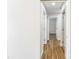 Hallway showcasing wooden floors and multiple doors leading to other rooms at 503 Gumwood Ct, Altamonte Springs, FL 32714