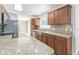 Kitchen features granite countertops, wood cabinets, tile backsplash and updated appliances at 503 Gumwood Ct, Altamonte Springs, FL 32714