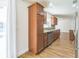 Kitchen features updated stainless appliances, wood cabinets, and hardwood flooring at 503 Gumwood Ct, Altamonte Springs, FL 32714