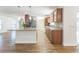 Open concept kitchen with breakfast bar island, stainless appliances and wood laminate flooring at 503 Gumwood Ct, Altamonte Springs, FL 32714