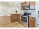 Kitchen features updated stainless appliances, granite countertops, and breakfast bar at 503 Gumwood Ct, Altamonte Springs, FL 32714