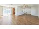 Spacious living room features modern ceiling fan, wood flooring and ample natural light at 503 Gumwood Ct, Altamonte Springs, FL 32714