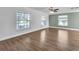 Spacious living room featuring three large windows that provide ample natural light at 503 Gumwood Ct, Altamonte Springs, FL 32714