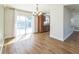 Bright living room features a chandelier, hardwood floors, and sliding glass doors to backyard at 503 Gumwood Ct, Altamonte Springs, FL 32714