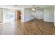 Spacious living room features modern ceiling fan, wood flooring and ample natural light at 503 Gumwood Ct, Altamonte Springs, FL 32714