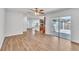 Open concept living area with sliding glass door to backyard and kitchen view at 503 Gumwood Ct, Altamonte Springs, FL 32714