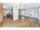 Bright living room features a chandelier, ceiling fan, hardwood floors and multiple windows at 503 Gumwood Ct, Altamonte Springs, FL 32714