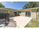 Exterior shot of the home with an outdoor patio and multiple glass doors at 503 Gumwood Ct, Altamonte Springs, FL 32714
