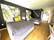 Charming bedroom featuring two beds, unique wall art, and warm wood floors for a cozy and stylish atmosphere at 5245 W Irlo Bronson Memorial Hwy # 194, Kissimmee, FL 34746