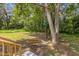 Beautiful backyard featuring a tree swing, mature trees, and lush greenery providing a peaceful outdoor space at 5851 Se Drew Rd, Belleview, FL 34420