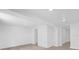 Unfinished basement space, painted white, offering potential for customization and additional living area at 5851 Se Drew Rd, Belleview, FL 34420