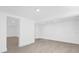 Basement area with white walls and tiled floors and recessed lights at 5851 Se Drew Rd, Belleview, FL 34420