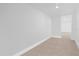 Basement area with white walls and tiled floors and recessed lights at 5851 Se Drew Rd, Belleview, FL 34420