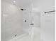 Clean and modern bathroom offers a walk-in shower with sleek, neutral design and black fixtures at 5851 Se Drew Rd, Belleview, FL 34420
