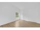 Cozy bedroom offers neutral walls, wood floors, natural light and closet storage space at 5851 Se Drew Rd, Belleview, FL 34420