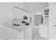 Modern kitchen featuring white cabinets, marble countertops, and stainless steel appliances at 5851 Se Drew Rd, Belleview, FL 34420