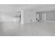 Open living space with updated kitchen and modern staircase, perfect for entertaining and Gathering living at 5851 Se Drew Rd, Belleview, FL 34420