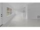 Bright, open living area with modern finishes and large windows, providing ample natural light and a spacious feel at 5851 Se Drew Rd, Belleview, FL 34420