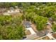 Aerial view of a new home surrounded by trees in a residential neighborhood at 610 E Euclid Ave, Deland, FL 32724