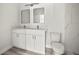 Modern bathroom featuring double vanity with bright mirrors and stylish fixtures at 610 E Euclid Ave, Deland, FL 32724