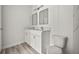 Modern bathroom featuring double vanity with bright mirrors and stylish fixtures at 610 E Euclid Ave, Deland, FL 32724