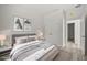 Calm bedroom featuring neutral tones, a stylish bed, contemporary decor, and ample natural light at 610 E Euclid Ave, Deland, FL 32724