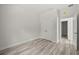 A bedroom offers wood-look floors and a closet with double doors at 610 E Euclid Ave, Deland, FL 32724